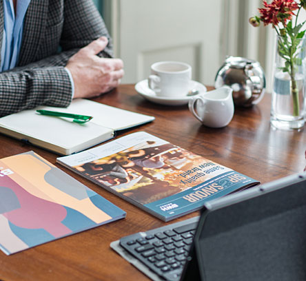 BWH Drinks brochures on a café table
