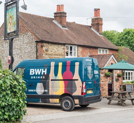 A BWH Drinks van outside a village pub