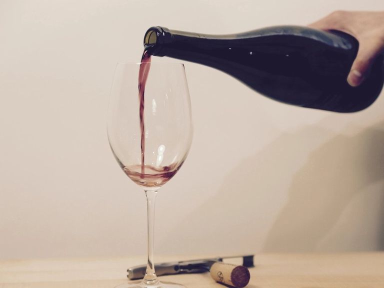 Red wine being poured into a glass